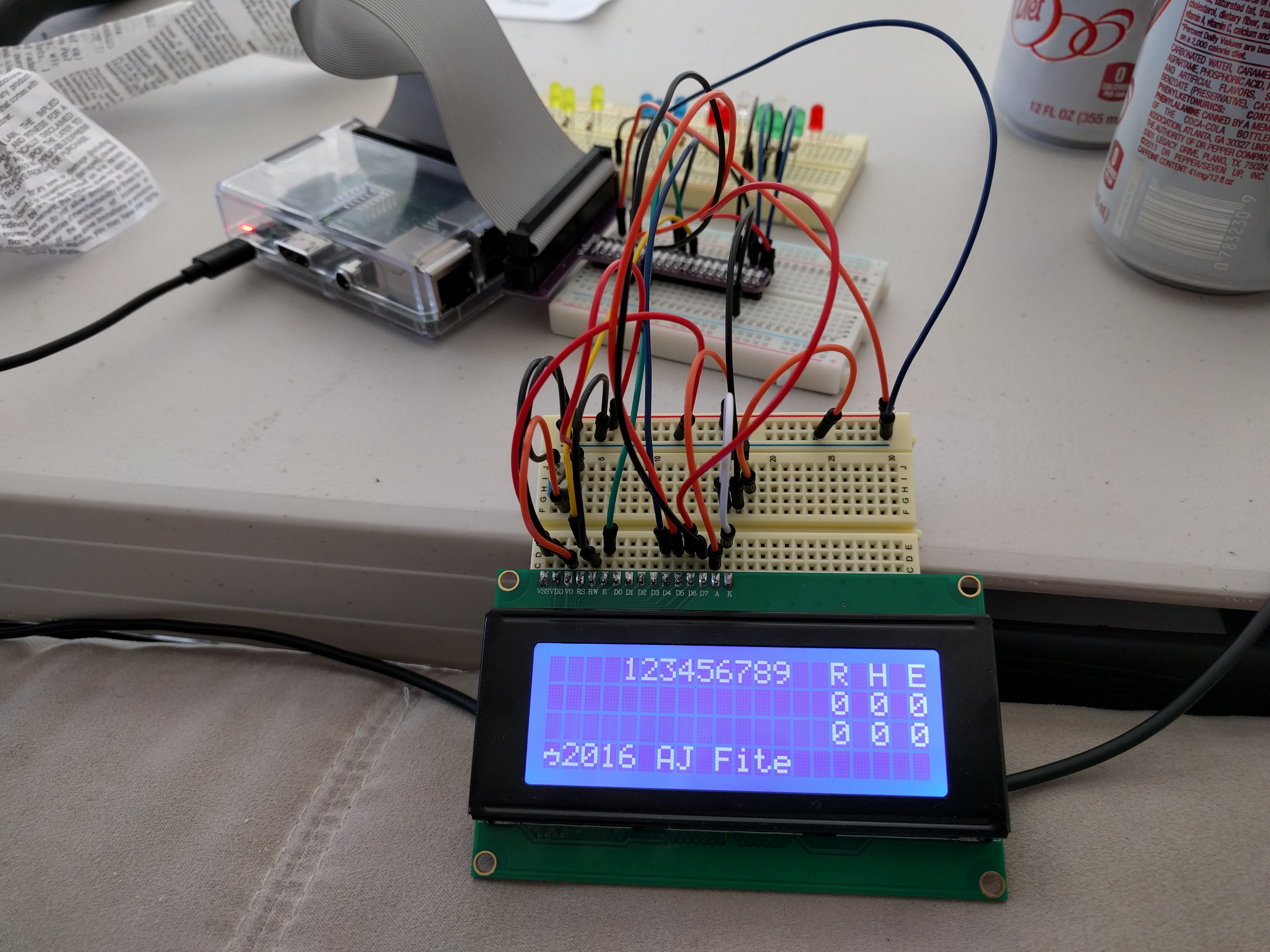 A picture of a raspberry pi wired with proto board to a 4 line alphanumeric display showing a rudimentary baseball scoreboard